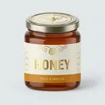 Natural honey bottle labels with elegant waterproof printing for premium food packaging and professional product branding.
