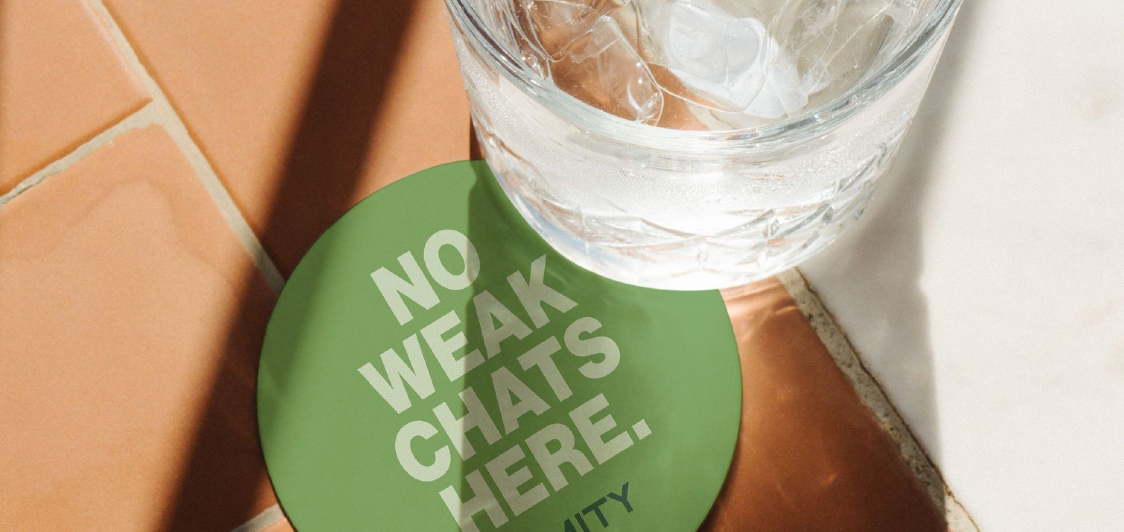 Café customer with reusable cup receiving discount