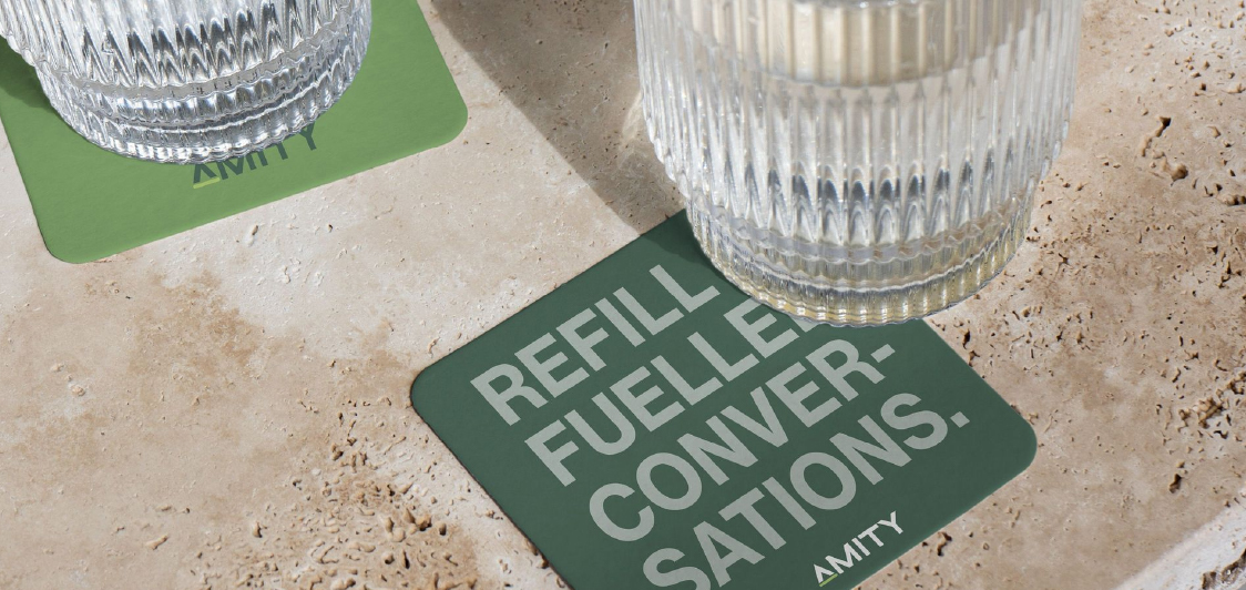 Custom branded coasters on bar table