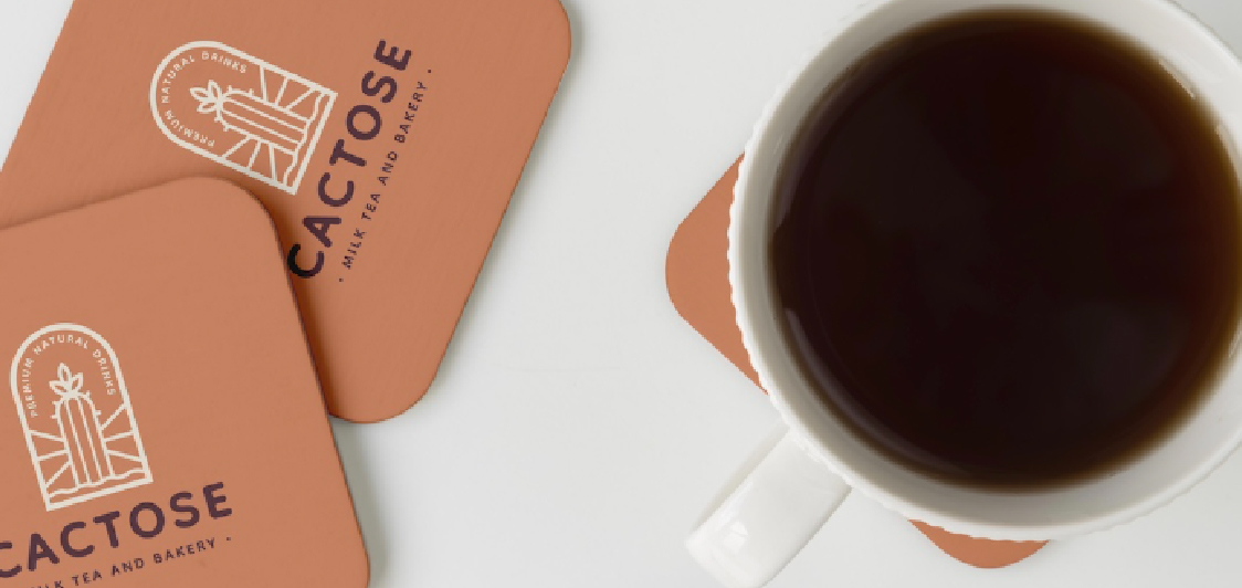 Restaurant table setting with branded coasters