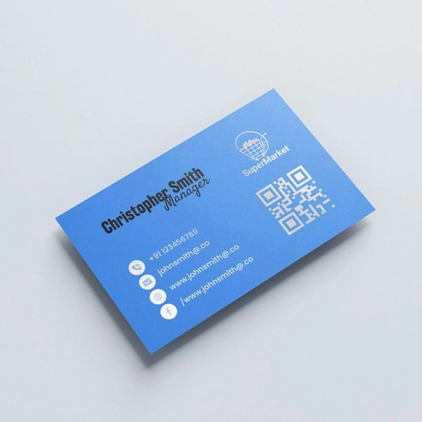 Blue embossed foil business card with silver foil logo, QR code and contact details
