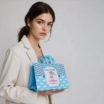Woman holding custom eco-friendly Enviro bag with Baby Shower print
